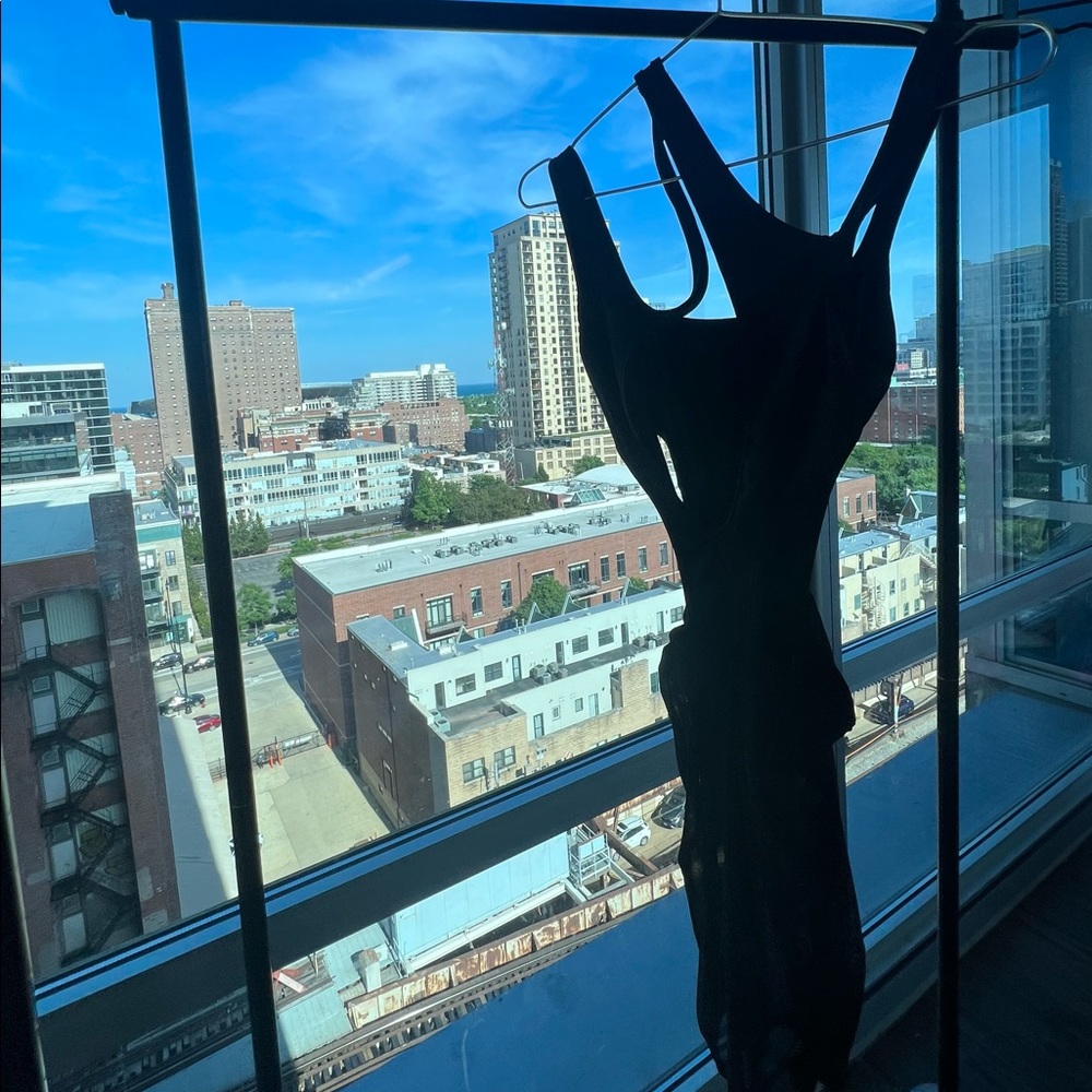 Swipe to see video of this black Mugler inspired vacation dress